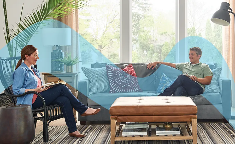 Comfortable couple on couch with fresh air | Indoor Air Quality | ZAP Cooling & Heating | 7336 GA-115, Cleveland, GA, 30528