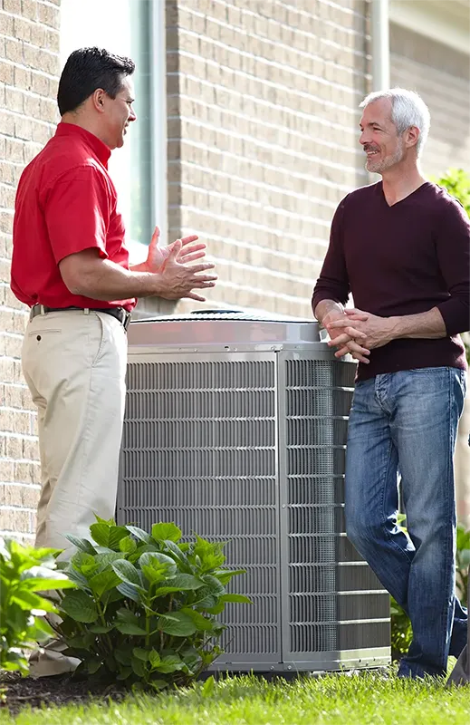 Heat Pump Repair Technician speaking with homeowner | Heat Pump Repair | ZAP Cooling and Heating